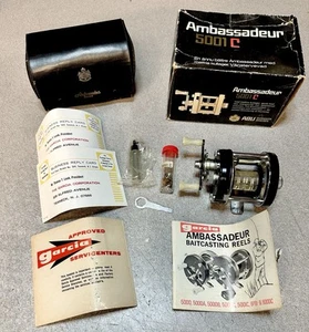 Ambassadeur 5001C Black Left Hand Drive Baitcasting Reel - New with Accessories - Picture 1 of 18