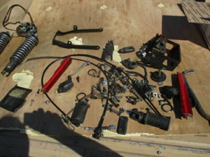 suzuki gs 750 e MISC PARTS LOT CABLES FOOT PEGS bolts  BATTERY BOX  shifter 78 8 - Picture 1 of 7