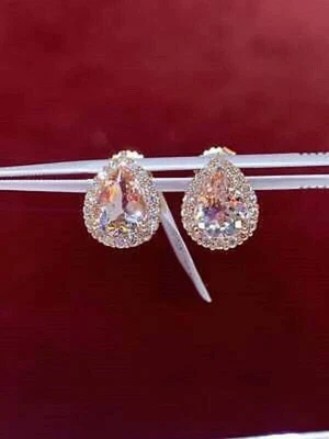 Aretes con halo de diamantes morganita talla pera de 3 quilates acabado en oro rosa de 14 quilates Foto 1 de 4