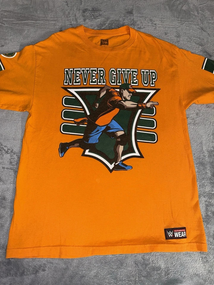 Camiseta gráfica WWE auténtica John Cena para hombre talla grande naranja You Can’t See Me Foto 1 de 4