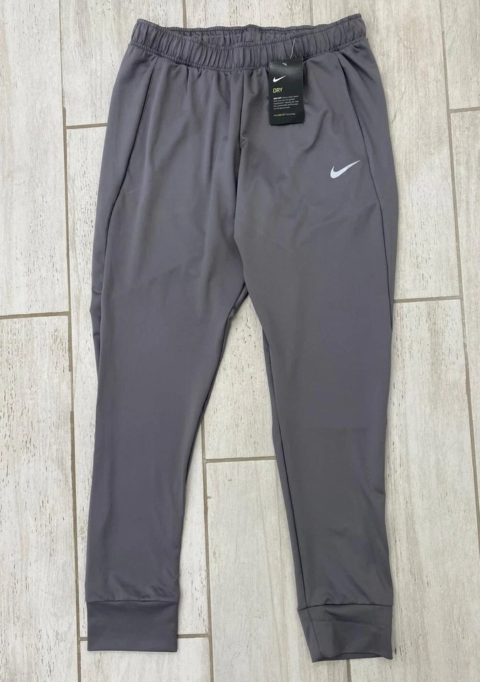 Pantalones de chándal Nike Dri-FIT para hombre ajustados gris oscuro talla S - XXL nuevos con etiquetas Foto 1 de 4