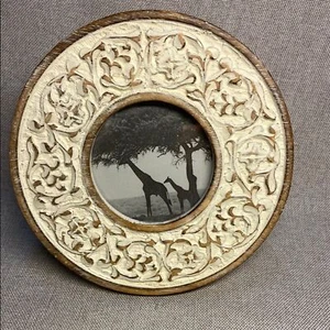 Decorative round, carved wooden picture frame with a distressed white finish. - Picture 1 of 6