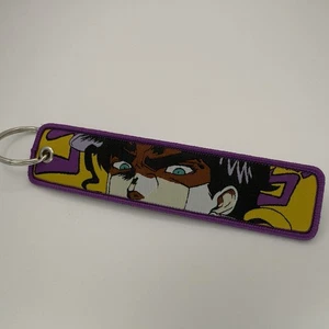 Jotaro Kujo Jet Tag - JoJo's Bizarre - doppelseitig bestickter Charm mit Schlüsselanhänger - Bild 1 von 2