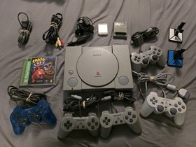 Sony PlayStation 1 System With 5 Controllers, 1 Memory Card, 1 Game, Ganeshark