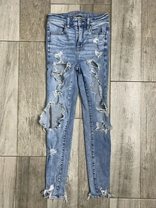 Jeans donna American Eagle Super Hi Rise Jegging taglia 0 blu denim strappato 24X27 - Foto 1 di 12