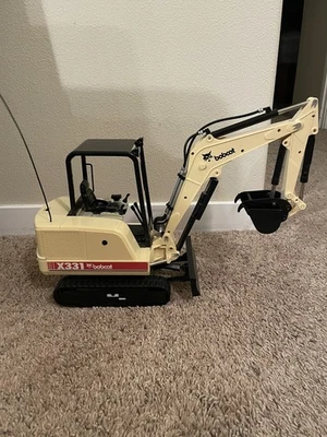 Raro juguete de construcción excavadora Bobcat X331 control remoto de colección probado Foto 1 de 4
