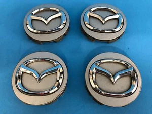 MAZDA CENTER CAPS GENUINE FACTORY ORIGINAL OEM SILVER CC1M-37-192 OEM SET OF 4 - Picture 1 of 6