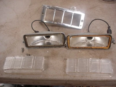 1963-1964 BUICK RIVIERA REVERSE LIGHTS PAIR & ONE RH BEZEL HOUSING GM OEM - Image 1 of 4