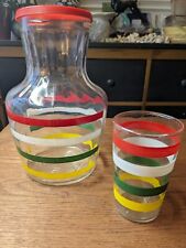 2 pc. 1940s mid century decanter w/glass   red, white, green and yellow strips.