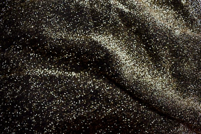 TELA TRANSPARENTE POLIÉSTER MALLA METÁLICA DORADA Y NEGRA 2 YARDAS Foto 1 de 2