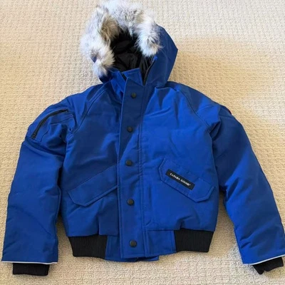 Chaqueta de bombardero Canada Goose Youth Rundle S 7-8 azul Pacífico piel capucha niños Foto 1 de 4