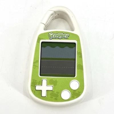 Konami Frogger 2011 juego electrónico portátil clip mosquetón probado funciona usado Foto 1 de 4