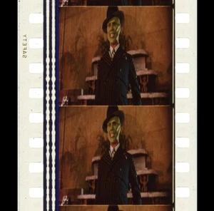 La Maschera - Sorridere in tuta - Striscia pellicola 35mm 5 celle 128 - Foto 1 di 3