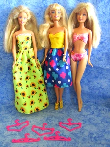 Barbie Dolls - Set of Three Barbie Dolls with 5 Hangers, Dresses and Shoes - Picture 1 of 6