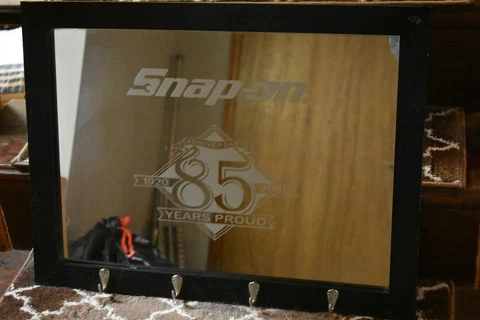 SNAP-ON Tools "85 Years Strong" Framed Mirror w 4 hat hooks. 24" x 18"  Preowned Cover
