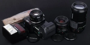 Olympus OM707 AF SLR + Grip, AF 50mm, AF 35-70mm, AF 70-210mm Lens & Flash Kit - Picture 1 of 13