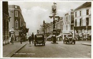 REAL PHOTO POSTCARD OF THE HIGH STREET, SUTTON, (NEAR MITCHAM / EPSOM) SURREY - Picture 1 of 2