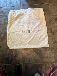 Bolso de mano grande HOBO International marfil con cordón cubierta antipolvo almacenamiento - Imagen 1 de 3