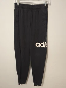 Felpa Adidas nera jogger con grafica logo bianco audace su tutta la gamba... - Foto 1 di 4