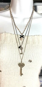 Costume Fashion Jewelry Necklace 17 inches long 3 strand bow and key beaded  - Picture 1 of 2