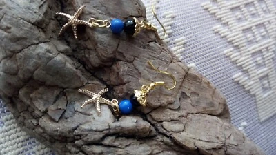 #Su coccu#Orecchini pendenti fortunacon onicenera e perla azzurrae stella marina - Immagine 1 di 2