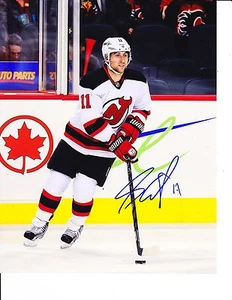 NEW JERSEY DEVILS STEPHEN GIONTA SIGNED WHITE JERSEY 8X10 - Picture 1 of 1
