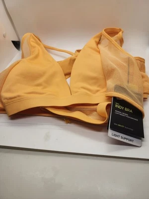 Sujetador deportivo Nike Indy, soporte ligero acolchado correa ajustable naranja mediano para mujer Foto 1 de 3