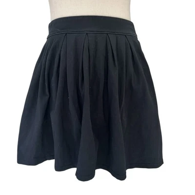 Falda plisada Talula para mujer talla pequeña negra línea A algodón mini corta (15) Foto 1 de 4