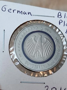 Moneda alemana UNC 2016 J 5 euros planeta tierra azul, con anillo de polímero azul  - Imagen 1 de 4