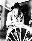 ROY ROGERS great 8x10 with gun and wagon wheel Western pose -- g917