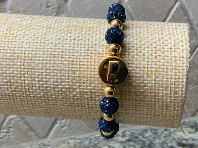 Brazalete rústico tono dorado con pulsera de diamantes de imitación azul marino con bolsa OKLAHOMA cuentas doradas Foto 1 de 4