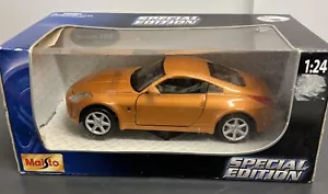 NISSAN 350Z 1:24 SCALE MAISTO RARE FIND ORANGE /GOLD - Picture 1 of 4