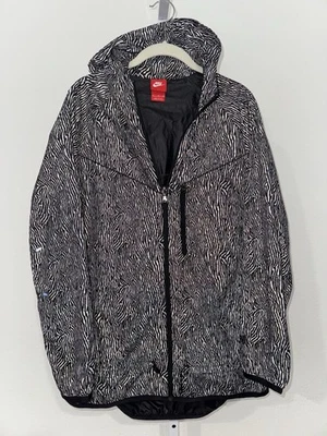 Chaqueta cortavientos Nike para mujer talla XL Windrunner negra con estampado flash Foto 1 de 4