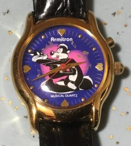 1995 ARMITRON WARNER BROTHERS LADIES MUSICAL WATCH w/PEPE LE PEW & PENELOPE CAT - Imagen 1 de 15