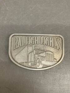 Vintage Raleigh Lights Semi Truck Gürtelschnalle - Zinnfarbe - Bild 1 von 8