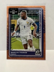 2025-26 Panini Donruss Optic World Cup Marcus Thuram /199 Orange Velocity #148 - Afbeelding 1 van 2
