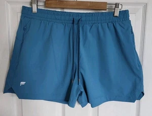 Pantaloncini Fabletics donna grandi blu The One corti 3" tasca zip vita alta nuovi senza etichette - Foto 1 di 13