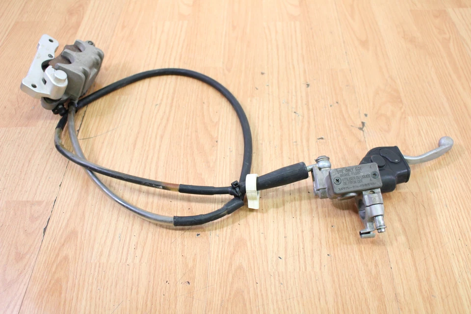 Suzuki RMZ 450 2012 cilindro maestro de freno delantero, pinza y línea Foto 1 de 4