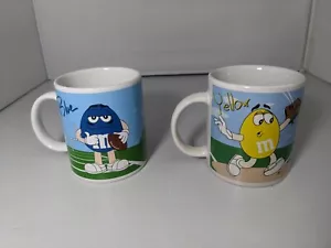 GOOD - Lot of 2 - Galerie M&M Coffee Mug - Blue / Red & Yellow / Red - Picture 1 of 8