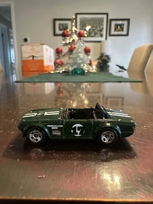 2009 Hot Wheels New Models #33/42 Triumph TR6 Dark Green - Image 1 of 4