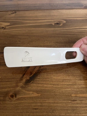 ZAPATO DE HOTEL BALLY'S CUERNO VINTAGE PLÁSTICO BLANCO DORADO LETRA GRÁFICO TALÓN PIE Foto 1 de 4