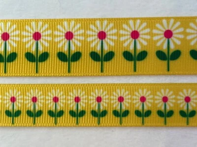 White daisies on yellow grosgrain ribbon pink centers green BTY 5/8" 7/8"  - Image 1 of 2