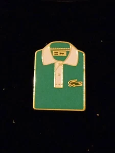 Pin's Polos Lacoste Bicolore Roland Garros Arthus Bertrand Paris - Afbeelding 1 van 2