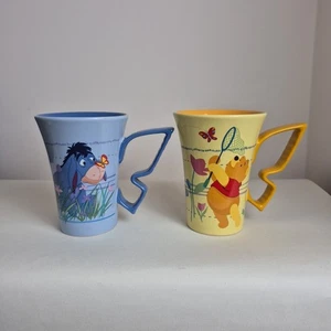 Disneyland Paris Exclusive Pair Of Winnie The Pooh Eeyory Mugs Butterfly Shaped - Picture 1 of 9