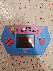 Vintage Acclaim The Simpsons Cupcake Crisis LCD Handheld Video Game 1990 Works - Picture 1 of 3