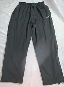 Pantaloni Nike Dri Fit grigio pista con zip alla caviglia e coulisse tasche zip grandi - Foto 1 di 6