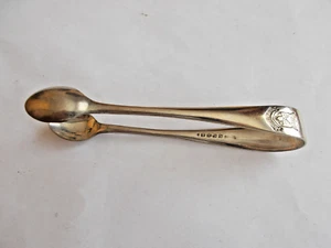 TONGS / HAS IMAGE ON THEM SEE PHOTO (02/05)POST O.SEAS - Picture 1 of 2