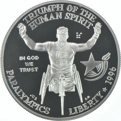 1996-P Proof Paralympics Wheelchair Commemorative Silver Dollar $1 - Image 1 of 3