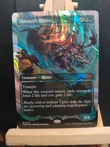 Skirmish Rhino (Showcase) Halo Foil - Tarkir Dragonstorm- NM (see pics) MTG - Picture 1 of 3