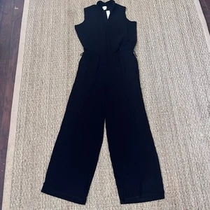 Chico’s Travelers Jumpsuit schwarz ärmellos Wickeloptik Größe 2 Medium - Bild 1 von 5